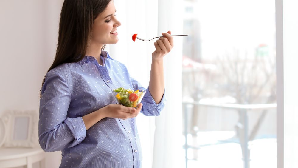 Pregnant Woman Eating Salad - NRKSS Blog